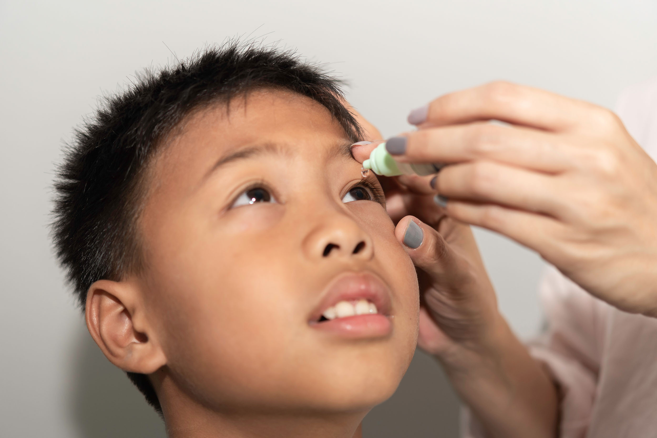 Applying eye drops to your own eyes or someone else’s eyes 